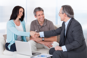 consultant shaking hand with happy woman