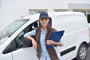 woman standing beside van