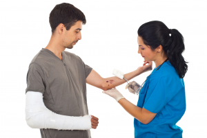 doctor cleaning wound hand to injured man